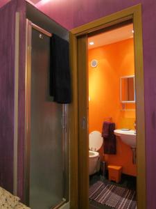 a bathroom with a toilet and a sink at La Terrazza sul Mare in Aci Castello