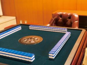 a ping pong table with a poker at APA Hotel & Resort Joetsu Myoko in Myoko