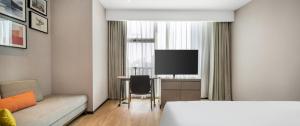 TV/trung tâm giải trí tại Home2 Suites by Hilton Shenzhen Nanshan Science & Technology Park