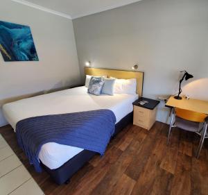 Postel nebo postele na pokoji v ubytování Alara Motor Inn