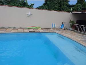 Piscina a Casa Guarujá c/ piscina grande o a prop