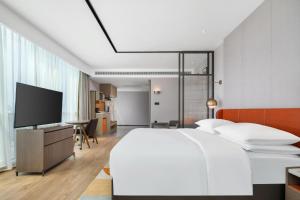 TV/trung tâm giải trí tại Home2 Suites by Hilton Shenzhen Nanshan Science & Technology Park