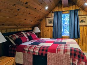 Postel nebo postele na pokoji v ubytování Cabin #4