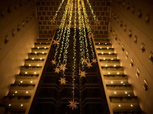 a staircase with christmas lights in a building at Sapporo View Hotel Odori Park in Sapporo