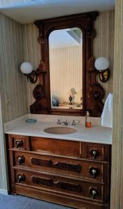 a bathroom with a sink and a mirror at Cabin #10 in Strawberry