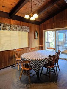 a dining room with a table and chairs at Cabin #10 in Strawberry