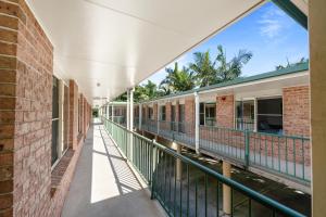 an empty hallway of a building with a balcony at Bent Street Motor Inn in Grafton +4 photos