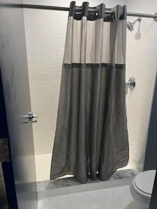 a shower curtain in a bathroom with a toilet at Orange County National Golf Center and Lodge in Orlando