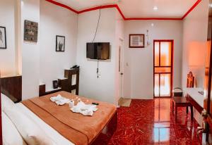 Postel nebo postele na pokoji v ubytování Victoria's Inn