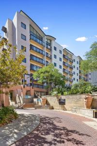 a building with a brick walkway in front of a building at 309 Secret City Sanctuary Prkingpoolview in Perth