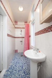 a bathroom with a sink and a shower at Pärnu Summer Home in Pärnu