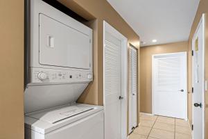 a laundry room with a washer and dryer at Sea Village 1105 in Kailua-Kona