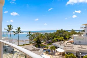 a view of the beach from the balcony of a resort at Vistablue @ the Bay in Urangan
