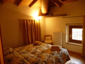 מיטה או מיטות בחדר ב-Tra Valpolicella e Lessinia