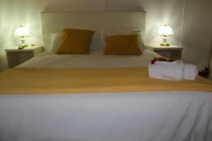 Postel nebo postele na pokoji v ubytování La Struzzo Boutique Hotel