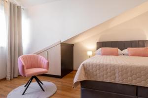 Postel nebo postele na pokoji v ubytování PENTHOUSE J&A