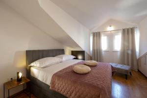 Postel nebo postele na pokoji v ubytování PENTHOUSE J&A
