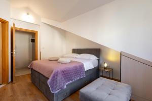 Postel nebo postele na pokoji v ubytování PENTHOUSE J&A