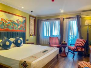 Postel nebo postele na pokoji v ubytování HOTEL DE SAPA