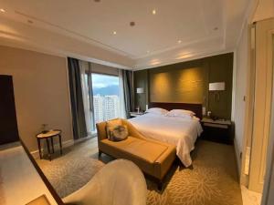 Krevet ili kreveti u jedinici u okviru objekta Wen Ling International Hotel