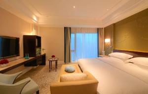Krevet ili kreveti u jedinici u okviru objekta Wen Ling International Hotel