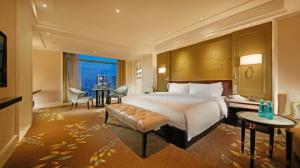 Krevet ili kreveti u jedinici u okviru objekta Wen Ling International Hotel