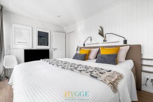 Schwimmendes Haus Hygge Olpenitz客房内的一张或多张床位