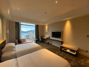 TV i/ili multimedijalni sistem u objektu Wen Ling International Hotel