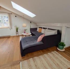 a living room with a couch and a table at Haus Grünfels ApARTment in Murau