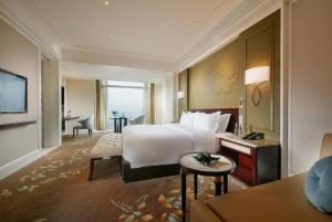 Krevet ili kreveti u jedinici u okviru objekta Wen Ling International Hotel