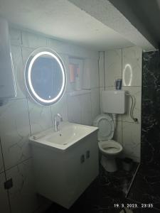 a bathroom with a sink and a toilet at Maksumic Apartman in Mostar