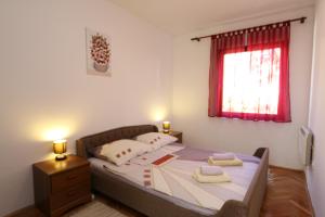 Postel nebo postele na pokoji v ubytování Apartment Lidija