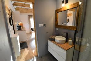 a bathroom with a sink and a mirror at DOMEK CHATKA BUKOWIANKA w Bukowcu koło Karpacza in Bukowiec +28 photos