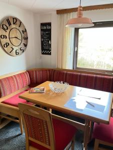 a living room with a table and a couch at Ferienwohnung Meijer in Briedel