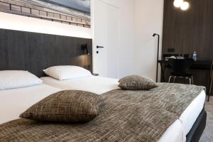 Postel nebo postele na pokoji v ubytování Hotel Apostroff