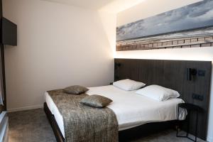 Postel nebo postele na pokoji v ubytování Hotel Apostroff