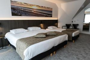 Postel nebo postele na pokoji v ubytování Hotel Apostroff