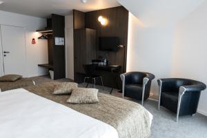 Postel nebo postele na pokoji v ubytování Hotel Apostroff