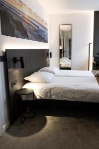 Postel nebo postele na pokoji v ubytování Hotel Apostroff