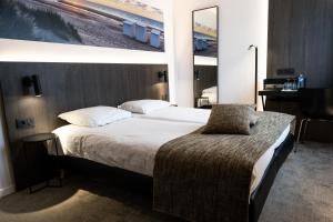 Postel nebo postele na pokoji v ubytování Hotel Apostroff