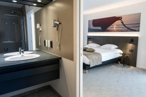 Postel nebo postele na pokoji v ubytování Hotel Apostroff