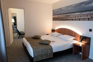 Postel nebo postele na pokoji v ubytování Hotel Apostroff