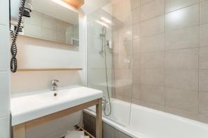 a bathroom with a sink and a shower at Appart'City Classic Lyon Part Dieu Villette in Lyon