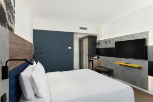 Postel nebo postele na pokoji v ubytování Danubius Hotel Helia
