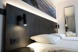 Postel nebo postele na pokoji v ubytování Hotel Apostroff