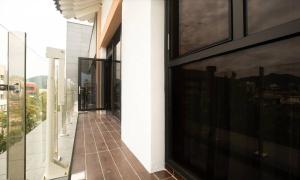 a balcony of a building with large windows at Jeonju Tourist Hotel kkotsim in Jeonju