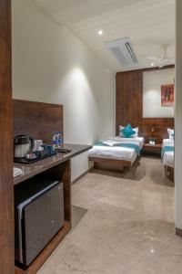 Postel nebo postele na pokoji v ubytování Hotel Devgiri