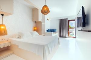 a white bedroom with a large white bed in it at 777 Alaçatı Adults only in Alacati +26 photos