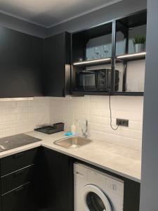 Kuchyň nebo kuchyňský kout v ubytování Apartamenty TOP Garbary