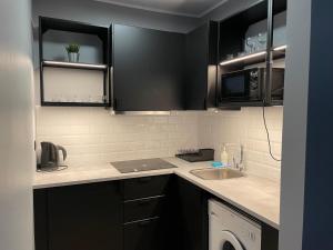 Kuchyň nebo kuchyňský kout v ubytování Apartamenty TOP Garbary